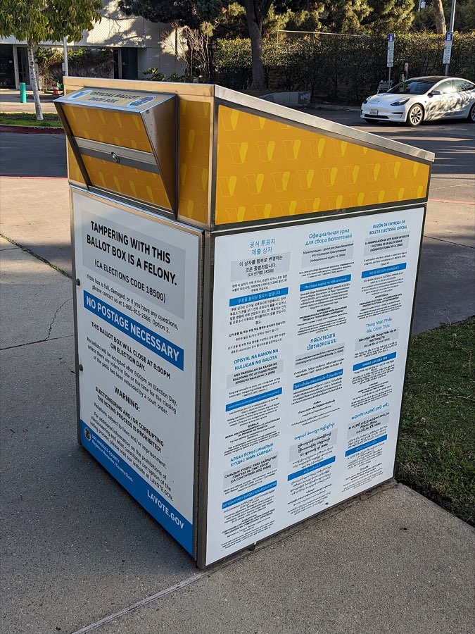 A secure ballot drop box outside a public library